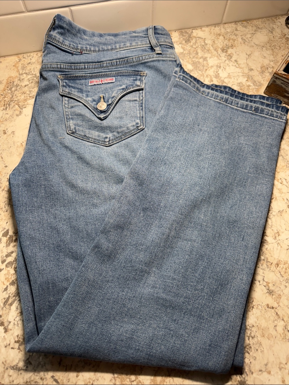 Hudson Jeans Women's bootcut Light Blue Denim.OG fray hem bottom, double button.